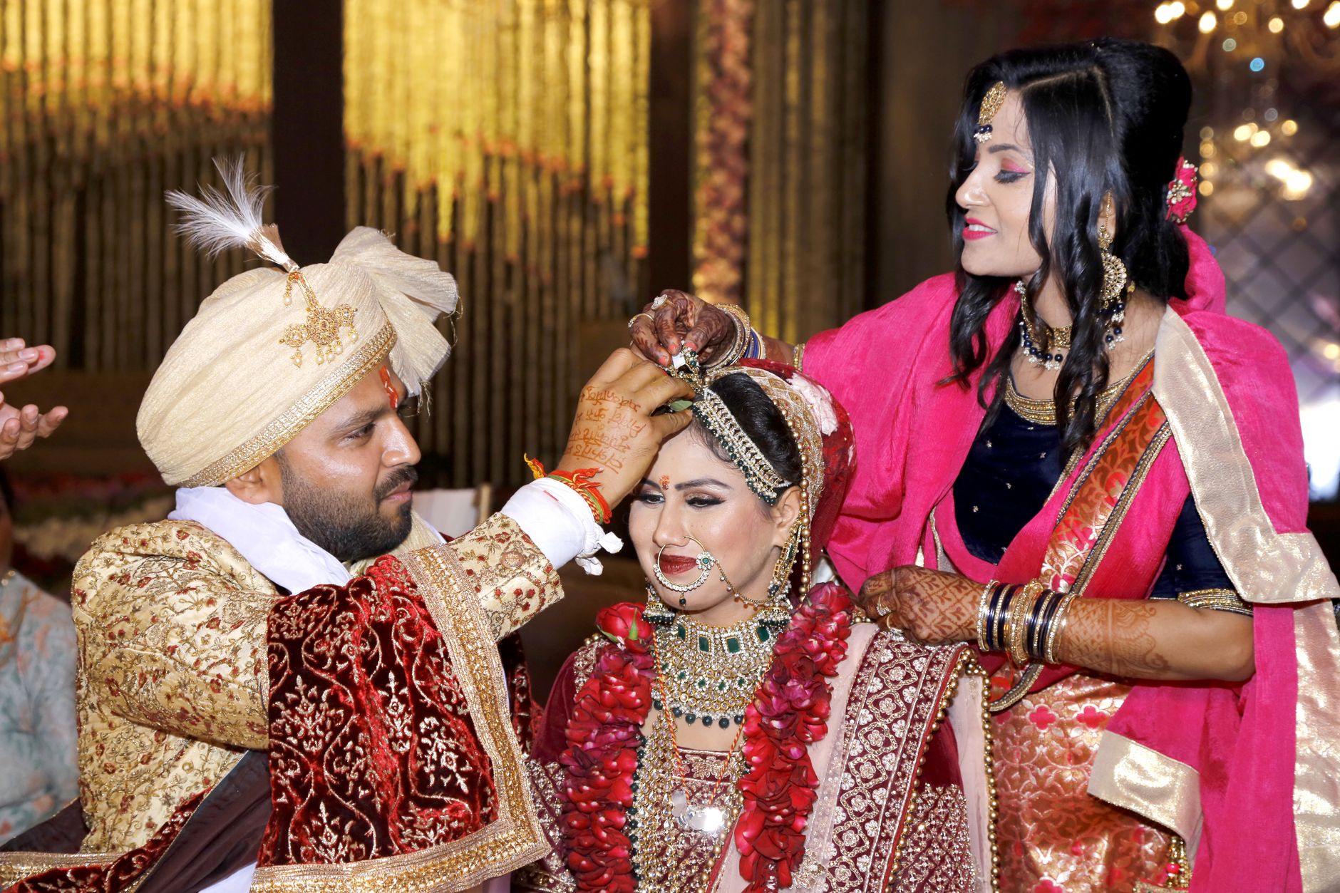 Bride and groom in a vibrant Indian wedding with cultural attire and customs.
